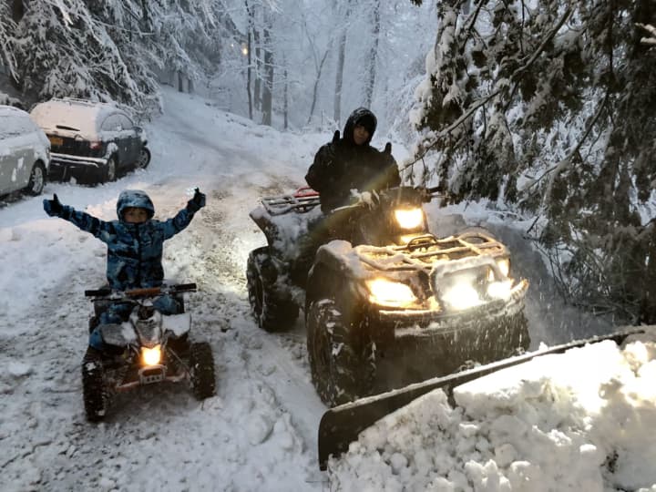 Darian Dedvukaj, 5, and his 14-year-old brother, Ivan enjoying this week&#x27;s winter weather in South Salem.
