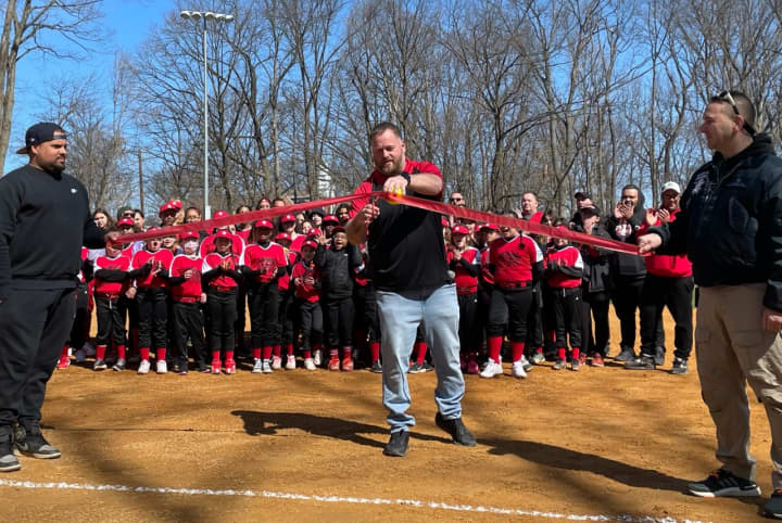 Bergenfield Little League President David DiLello officially reopens the renovated Staunton Field.