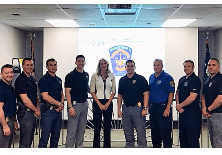(FROM RIGHT:) Garfield Police Officers Robert Napolitano, Daniel Duleski and Jeff Stewart, Sgt. Nicholas Santillo, Manchester Police Chief Lisa Parker and training officers.