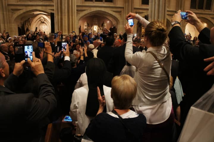Thursday evening just before a Vespers service as thousands of people -- including four nuns from the Mariandale Convent -- take personal photos of Pope Francis as he proceeds into St. Patrick&#x27;s Cathedral.