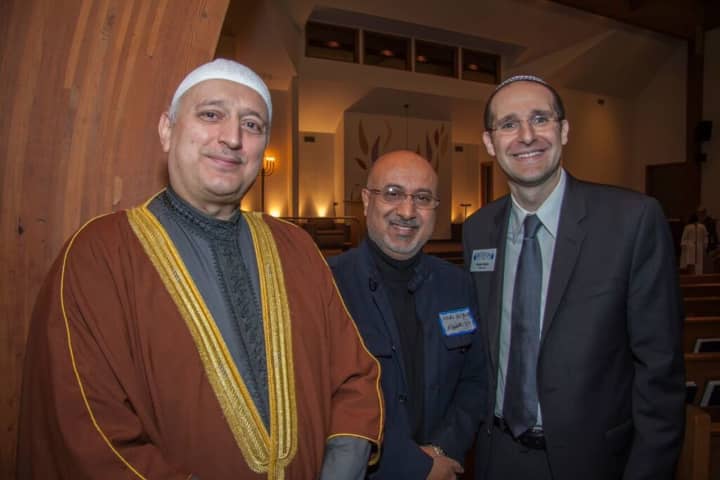 Imam Moutaz Charaf, left, with Rabbi Noah Fabricant, far right, and a participant of the Temple Beth Or Interfaith Service.