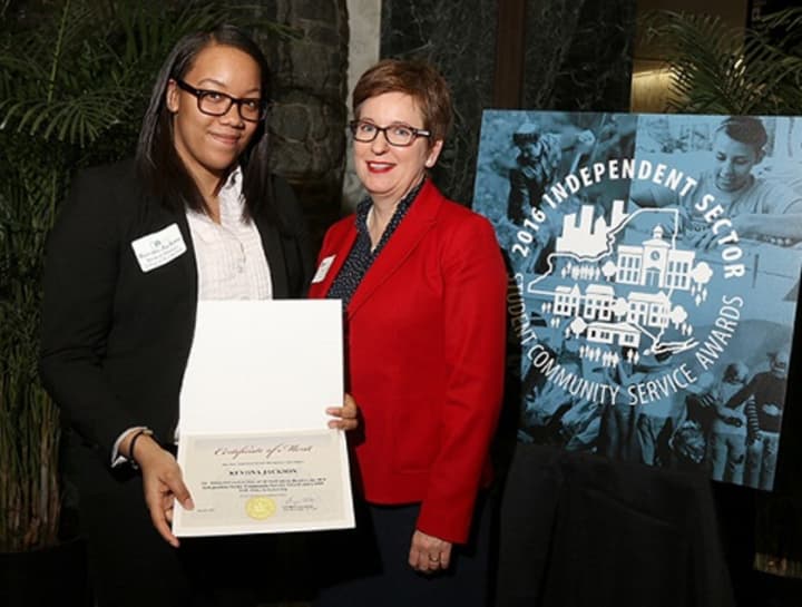 Kevona Jackson, left, a business student at the College of New Rochelle, is the recipient of a service award and a scholarship. With Jackson is Dr. Danielle Wozniack, dean of the college&#x27;s School of Arts and Sciences.