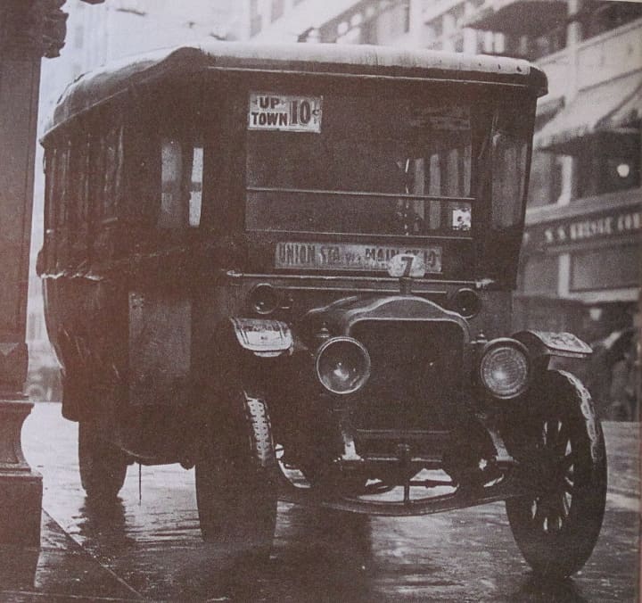 An old fashioned jitney, circa 1915. 