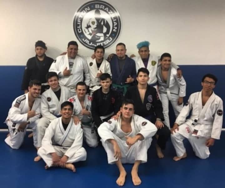Clifton Brazilian Jiu-Jitsu students gather on the mat.