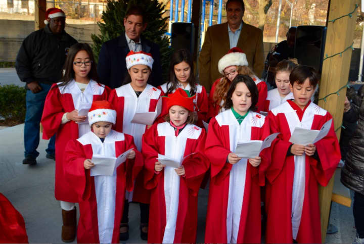 The St. Peter and Paul Children’s choir entertained the crowd at the annual tree lighting in Mount Vernon. 