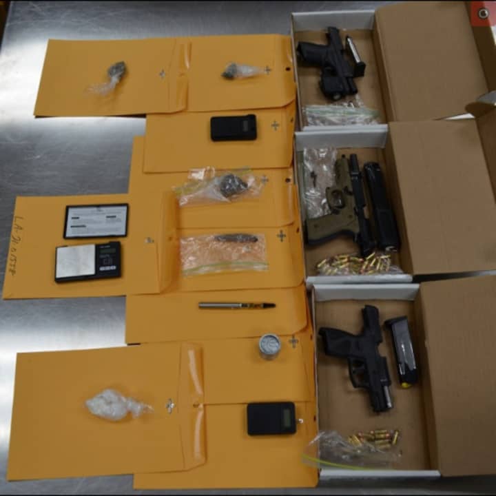 Three loaded handguns, 44 rounds of ammunition, baggies of marijuana, digital scales, drug paraphernalia, a baggie of suspected crack cocaine and approximately $1,500 recovered at Capital City Mall.