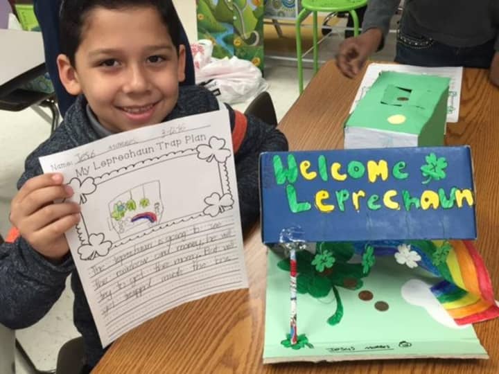 A Columbus Elementary School student shows off his &quot;leprechaun trap.&quot;