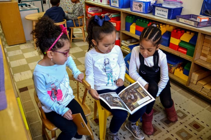 First graders at The Lee F. Jackson Elementary School read to kindergartners in celebration of Dr. Martin Luther King Jr.&#x27;s birthday.