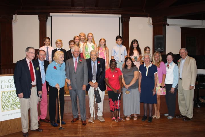 Local students honored 12 local adults recently at the Pequot Library in an event called “Meet Our Local Heroes from the Community.” 
