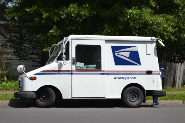 A Meriden mail carrier is accused of stealing mail and distributing cocaine, federal authorities said.