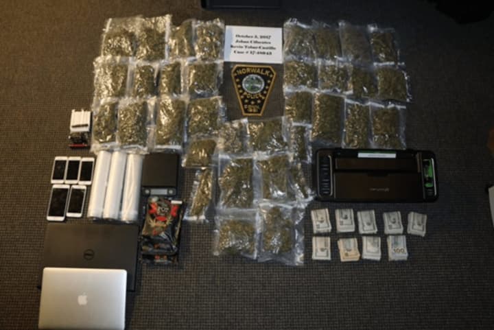 Police seized more than 4 kilograms of marijuana from two Stamford men staying at a Norwalk hotel.