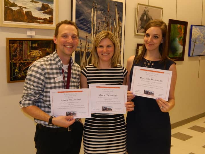 James and Marie Trapasso and Mallory Marinaro received employment milestone certificates at the Ossining Public Library&#x27;s annual meeting.