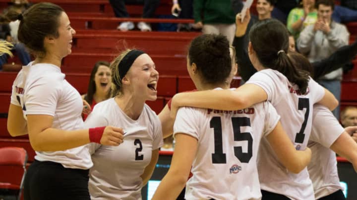Fairfield University&#x27;s Megan Theiller (2) celebrates with teammates as the Stags won the the Metro Atlantic Athletic Conference vollyeball championship.