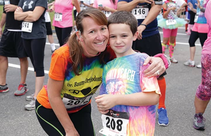 This mother and son enjoyed the festivities of the first Autism SpectRun, the Kennedy Center 5K Fun Run/Walk/Stroll. This annual event serves as a major benefit for The Kennedy Center’s Autism Project.