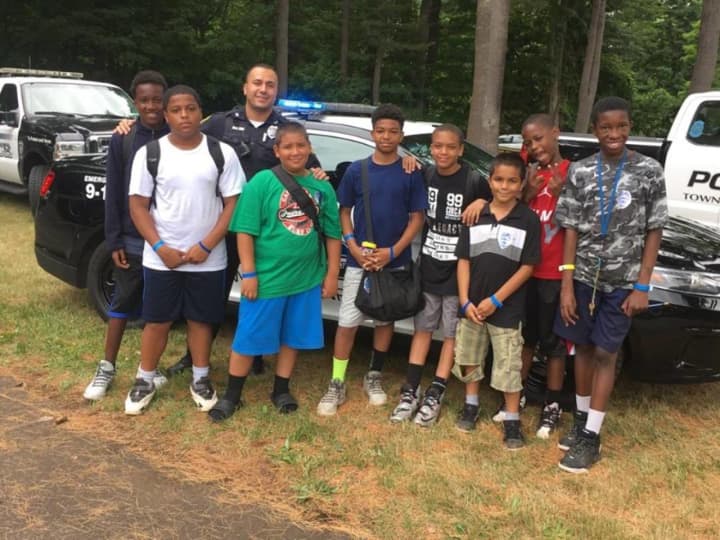 Monroe Police Officer Omar Wahib recently visited Camp Courant for Law Enforcement Day.
