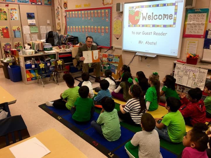 Superintendent Joseph Abate reads to a kindergarten class.