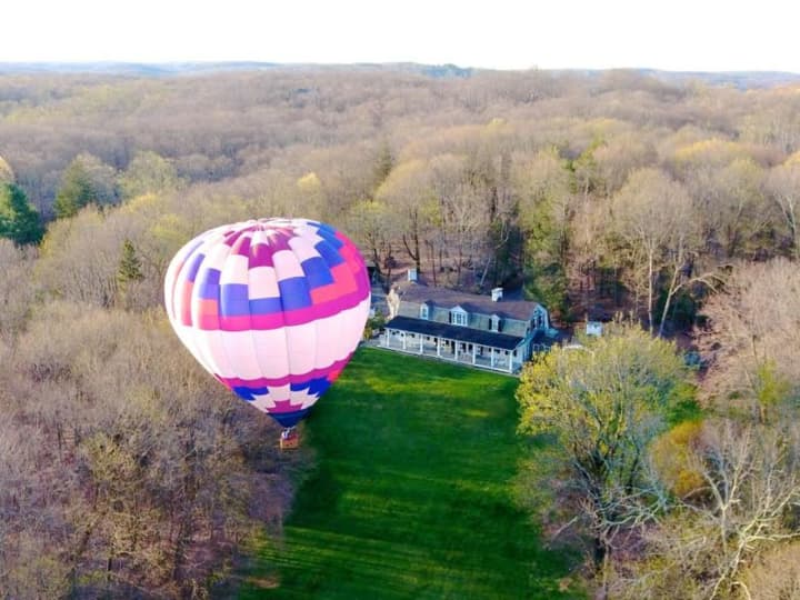 Ginnel Real Estate agent Muffin Dowdle took a hot air balloon trip to help showcase the property at 270-306 Hook Road in Bedford.