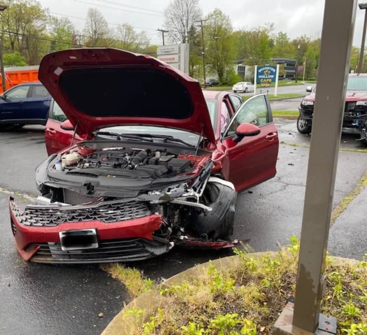 A Jeep sitting in a Fairfield County car dealership parking lot was damaged when it was hit by a vehicle involved in a two-car crash.