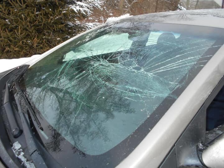 This car&#x27;s windshield was smashed in Newtown when ice and snow flew off another car.