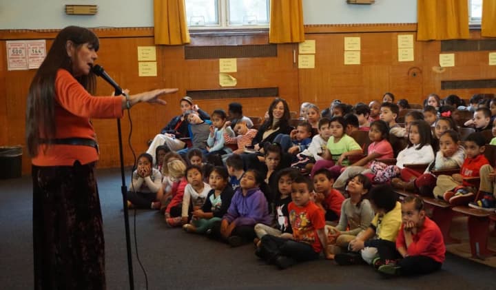 Students sit rapt as they listen to Native American storyteller Dovie Thomason at Jefferson Elementary School.