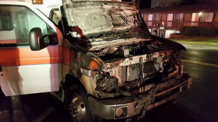 A rig owned by the New City Ambulance Corps was severely damaged by fire Thursday, but thanks to the quick actions of a passerby, no one was hurt.