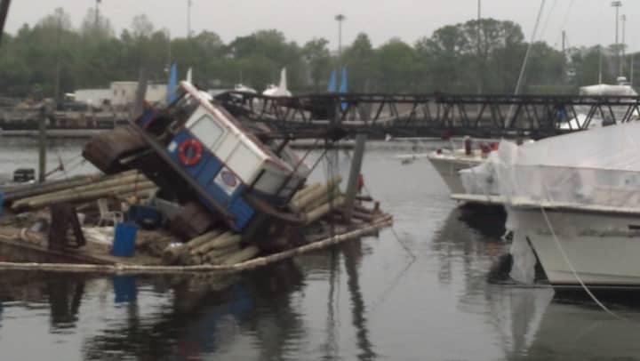 A crane toppled over onto a boat at a marina in Stamford. 