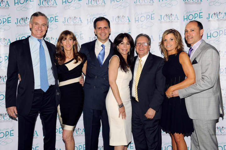 Stephen (third from left) and Lory Gilberg (center) were honored at the Jewish Child Care Association&#x27;s annual benefit. 
