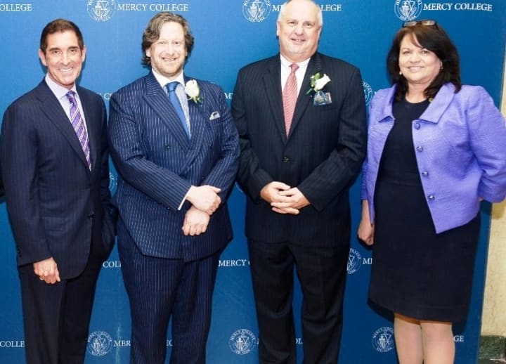 New York State Senator Jeffrey D. Klein, Douglas D. Gollan, Michael Robinson, and Dr. Kimberly Cline at the Mercy College Trustees&#x27; Scholarship Dinner, which raised more than $400,000 for student scholarships. 
