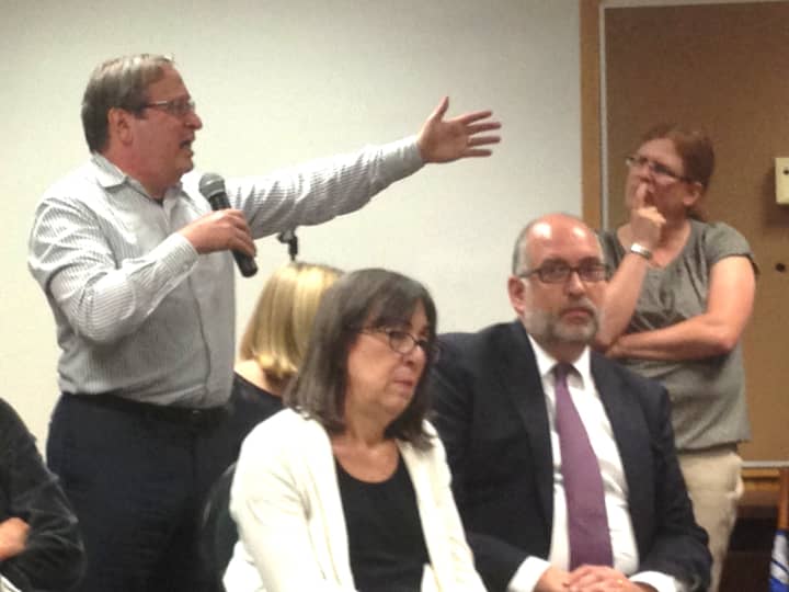 Scarsdale residents rail against the failed 2013-2014 Scarsdale school budget at a May 23 public forum.