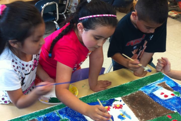 Students at Edison School paint tiles for the school&#x27;s version of the Sistine Chapel as part of Port Chester&#x27;s National Art in the Schools Day.