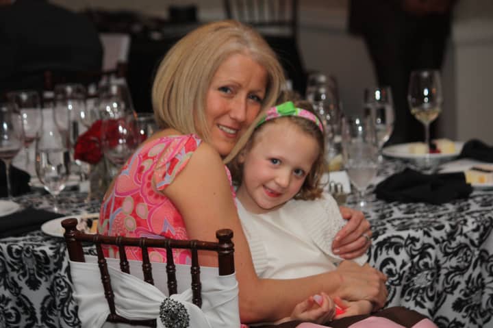 Linda Queenan and her &quot;tiny miracle&quot; daughter, Lilah, of Ridgefield enjoy the Tiny Miracles Foundation gala in Darien.
