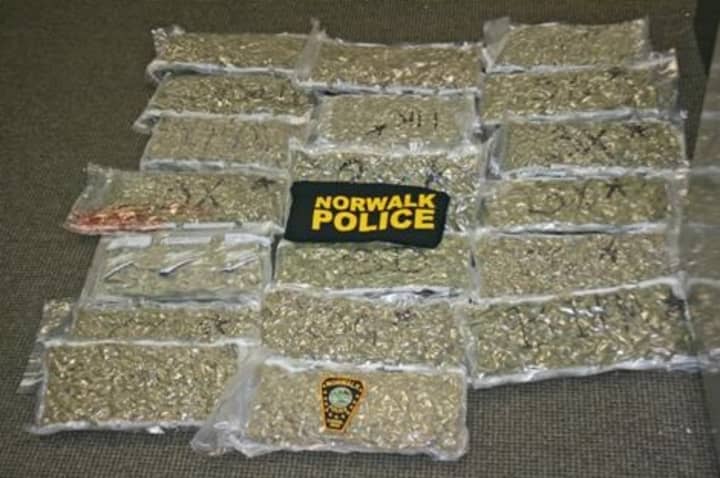 Norwalk police broke up a marijuana operation Thursday that is believed to have been sending in excess of 400 pounds of pot into the city. Above is 20 pounds of pot seized from a Taylor Avenue home on Thursday.