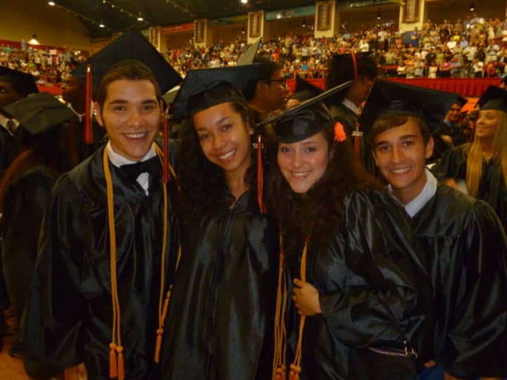 Last year&#x27;s White Plains High School graduates smile in the Westchester County Center. This year&#x27;s ceremony will be held Thursday.