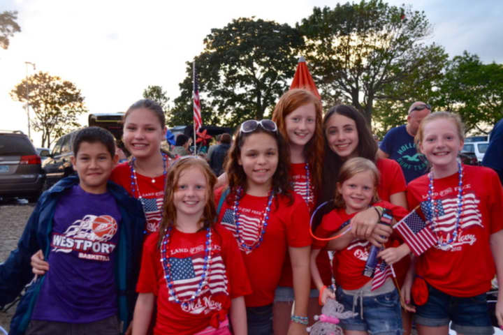 A patriotic group of fireworks fans in Westport enjoy Independence Day celebrations.