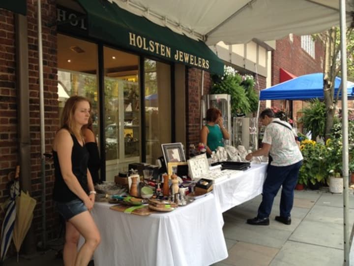 Scarsdale shoppers look through various goods and jewelry outside Holsten Jewelers at last year&#x27;s Sidewalk Sale.