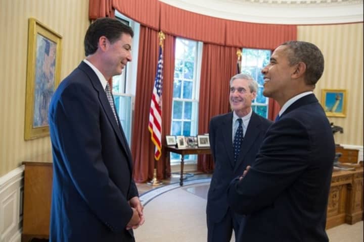 President Barack Obama talks with James Comey, left, and FBI Director Robert Mueller in the Oval Office prior to announcing Comey&#x27;s nomination to succeed Robert Mueller as FBI director on Friday. 