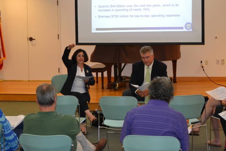 From left: State Sen. Toni Boucher and State Rep. John Shaban talk with residents at a town hall meeting in Weston this week.