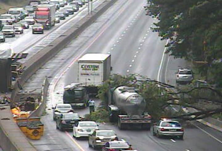 A tree blocking two lanes of northbound I-95 near Exit 5 in Greenwich on Thursday, causing huge traffic backups. 