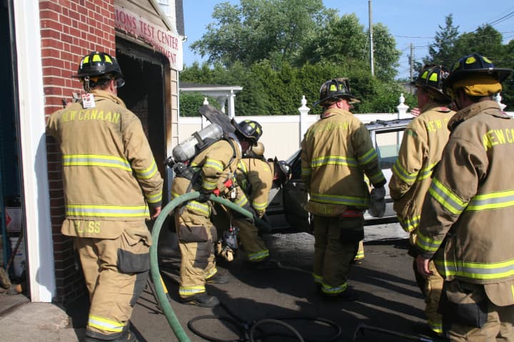 New Canaan Fire Company puts out a blaze at AC Auto Body &amp; Mechanic at about 5 p.m. Monday.