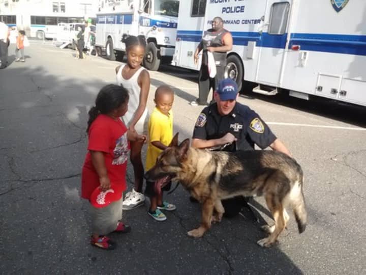 Children meet the Mount Vernon K-9 unit at last year&#x27;s National Night Out.