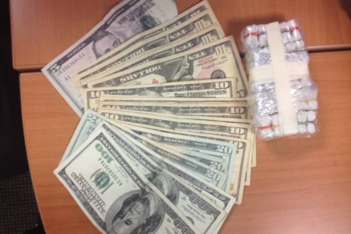 The cash and heroin above were seized in a drug bust in Norwalk Thursday, police say.