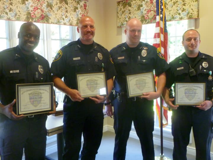 From left: Officers Rex Sprosta, Scott Humberg, Michael O&#x27;Sullivan, and Daniel Gulino were honored for their bravery shown in incidents earlier this year. 