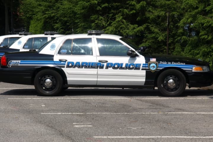 Darien police said a Norwalk man drove his car into a shift supervisor on patrol early Sunday morning.