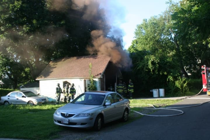 Firefighters were able to put out a garage fire on Spring Hill Avenue in Norwalk within 10 minutes Tuesday. 