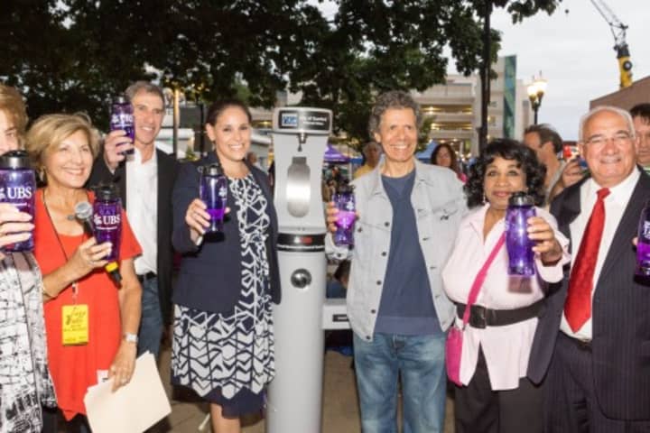 City officials join Sandy Goldstein, of Stamford Downtown Special Services District; Bill Apfelbaum, Smart Tap; Lori Feinsilver, of UBS; and Chick Corea, Jazz Pianist at Wednesday&#x27;s Jazz Up July to test the water station in Columbus Park. 