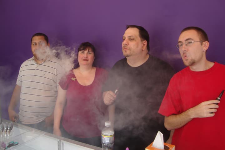 Ethan Brill, Rosanna Manente, Luciano Manente and Kenny McClure at the electronic cigarette store Honest Vapor in Harrison.