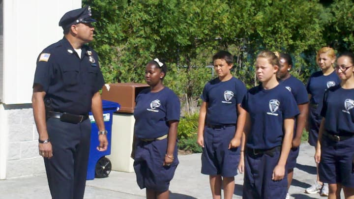 Greenburgh Police Officer David Zenon, a Summer Youth Camp instructor. put his cadets through their paces at graduation.