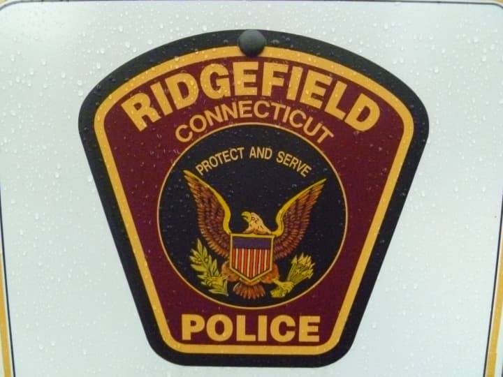 An 80-year-old Ridgefield resident turned herself in to police in connection with a fatal motorcycle accident in July.