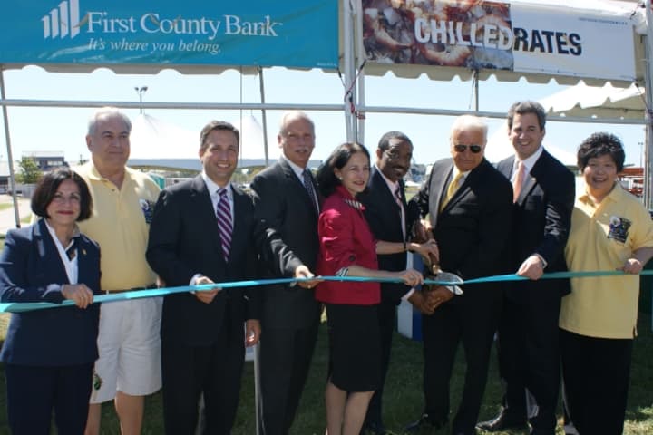 Local and state officials and organizers cut the ribbon on the 2013 Norwalk Oyster Festival.