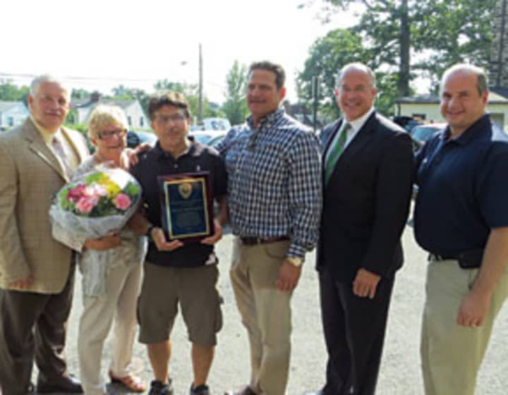 Eastchester officials presenting the Lanza Family Foundation with a plaque in appreciation of its donation.